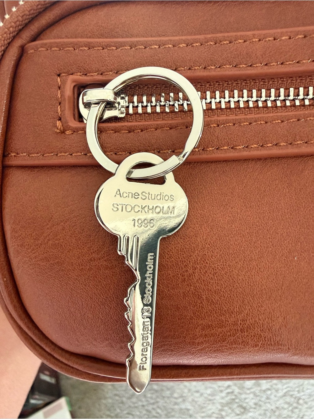Acne orange leather interior with silver zipper hardware